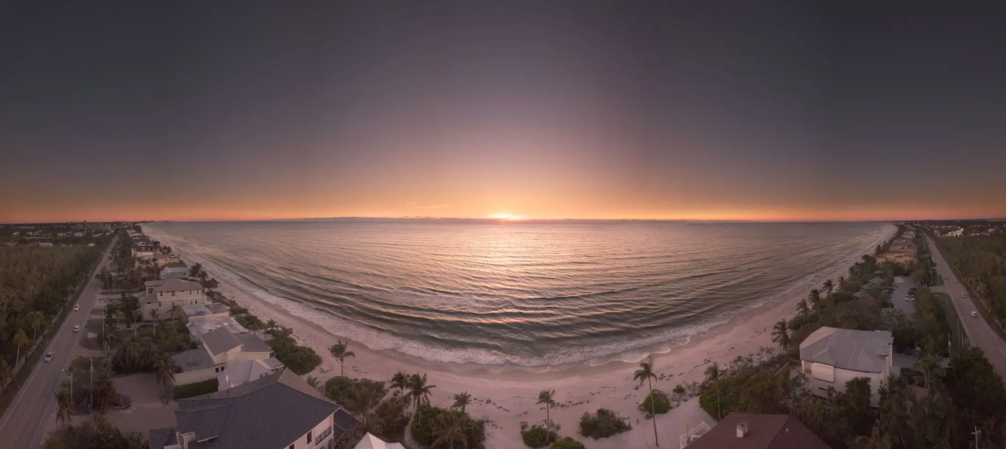 Aerial view of a Southwest Florida Gulf beach at sunset