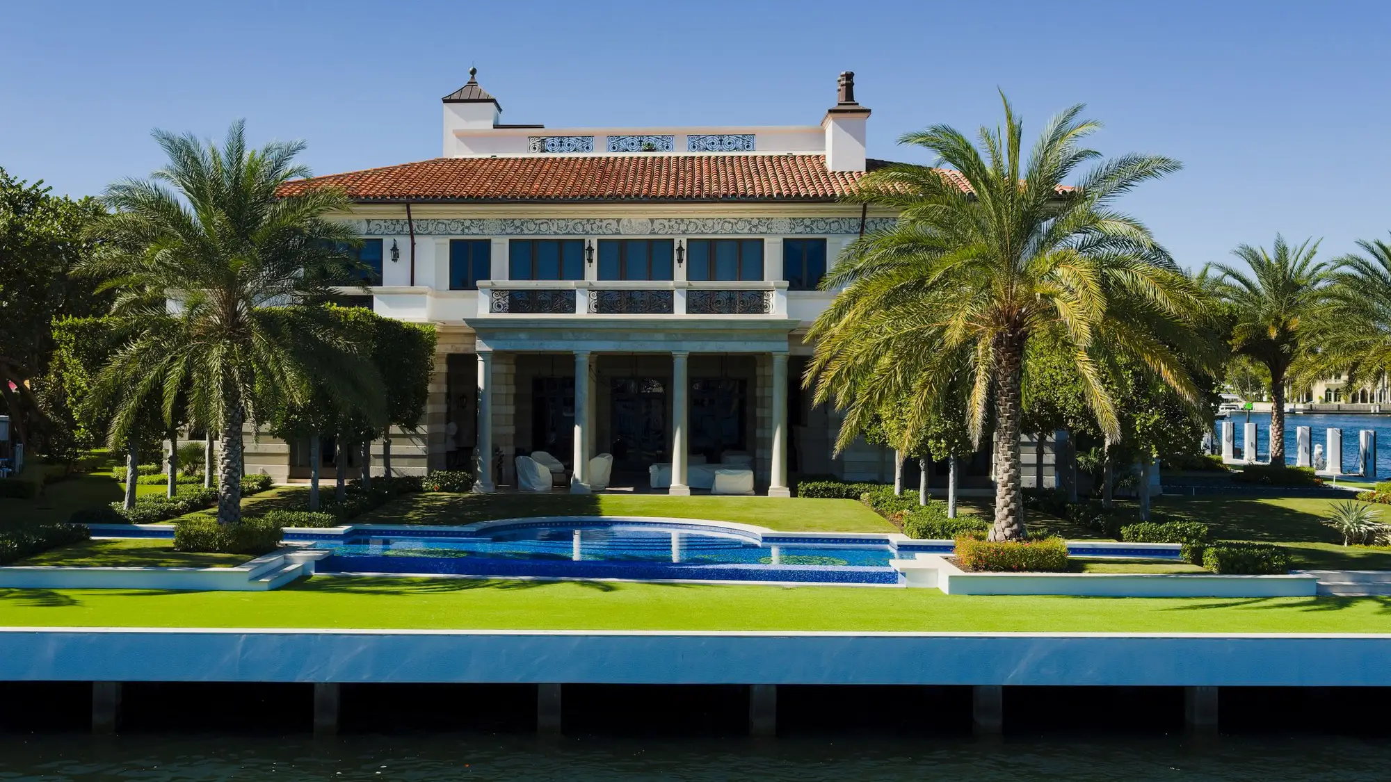 Luxury Florida residence with a swimming pool among palm trees